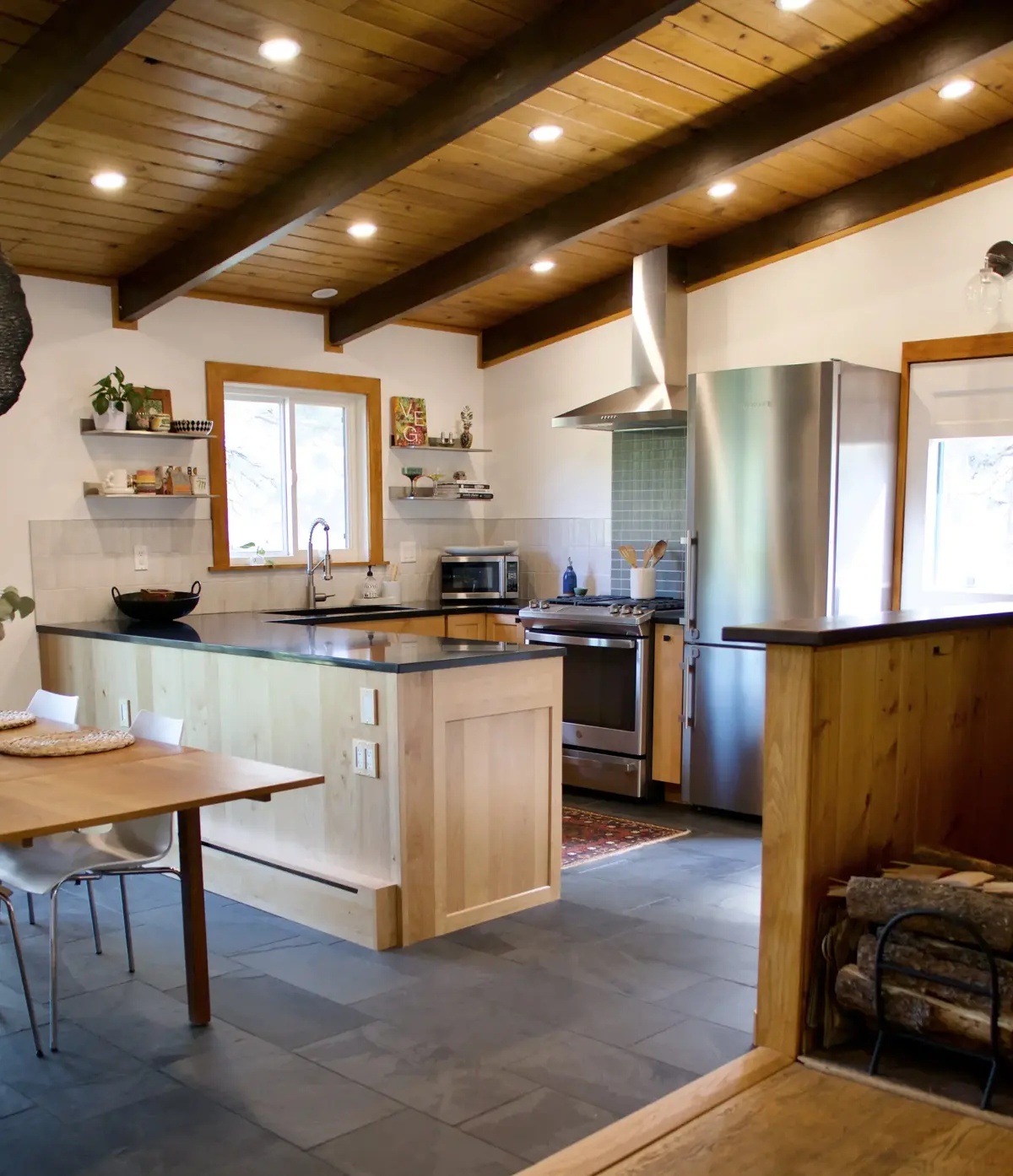 Sunshine Canyon kitchen remodel with sloped ceilings, new cabinetry, counters, tile, and recessed lighting